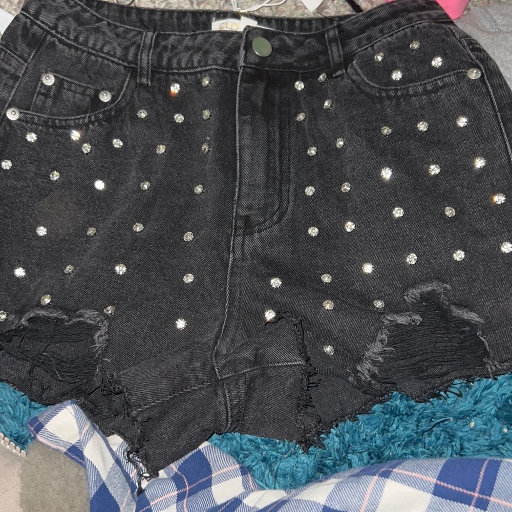 Black denim shorts with diamonds on the front
